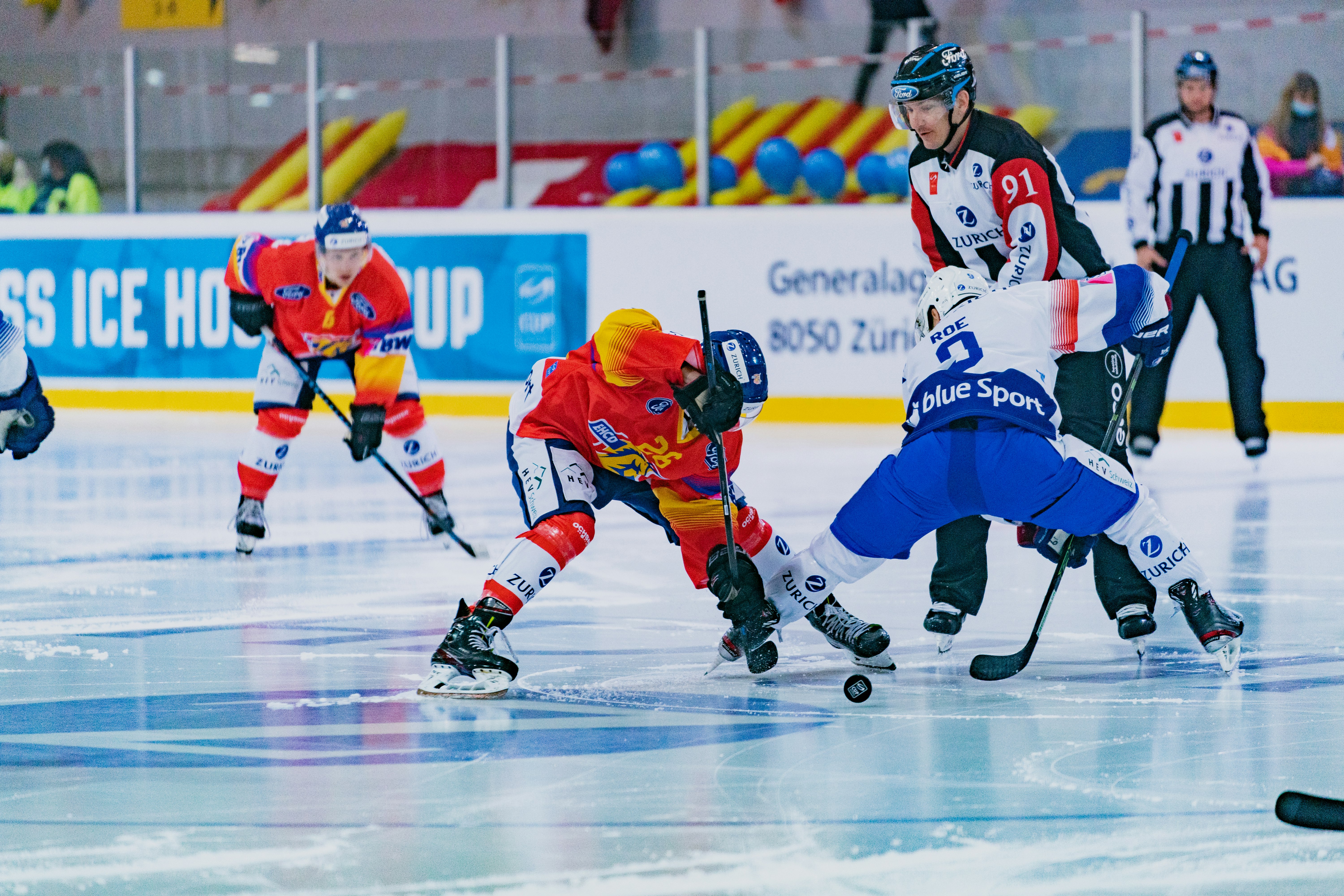 2 men in ice hockey jersey playing